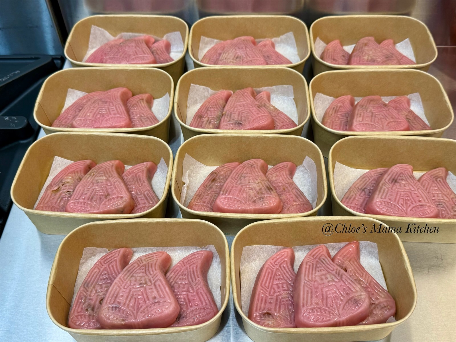 Boxes of pink Teochew Png Kuih in the kitchen, with the Chloe’s Mama Kitchen watermark