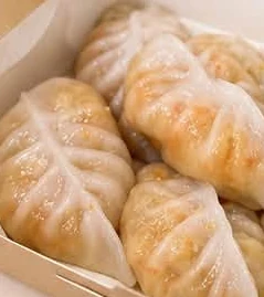 Jicama chai kuih with translucent skins in a box.