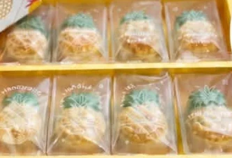 Individually wrapped pineapple tarts in their box.